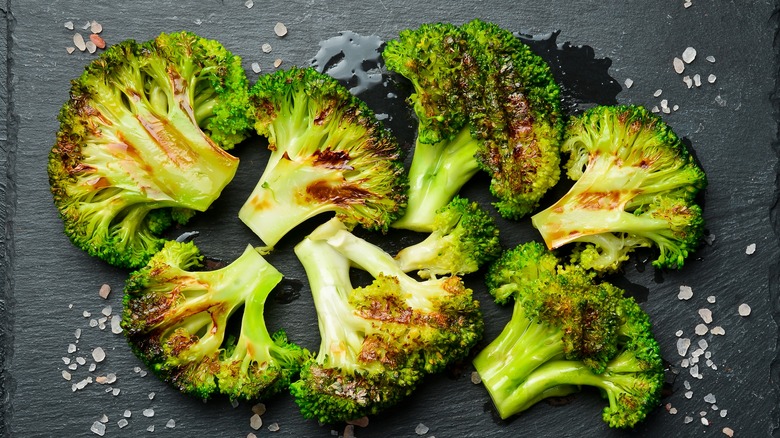Roasted broccoli on a tray.
