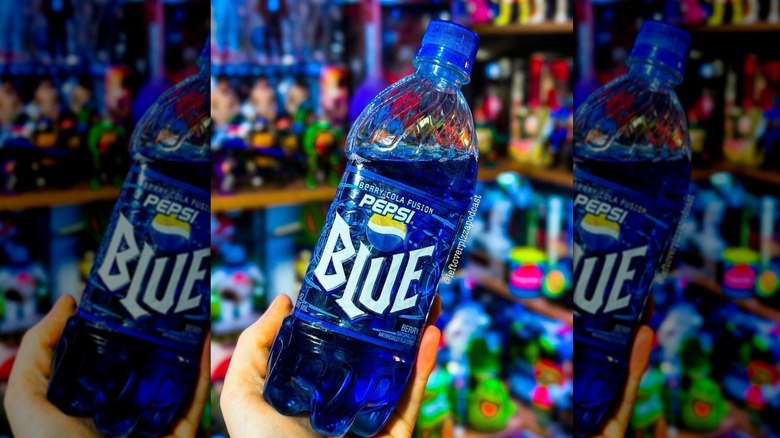 Bottles and a glass of Pepsi Blue outside