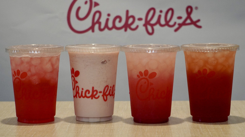 Cherry Berry lineup on a tan table in front of a white Chick-fil-A step and repeat