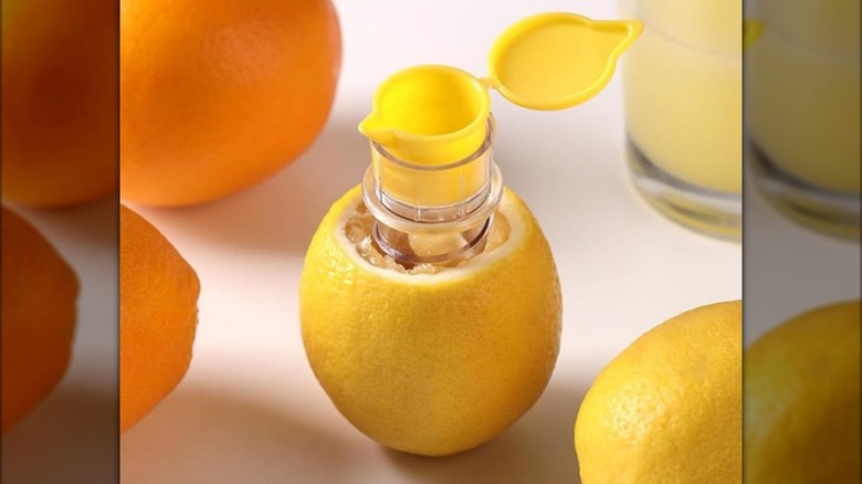 Corkscrew-style lemon juicer inside lemon