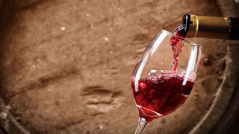 Red wine being poured into a glass