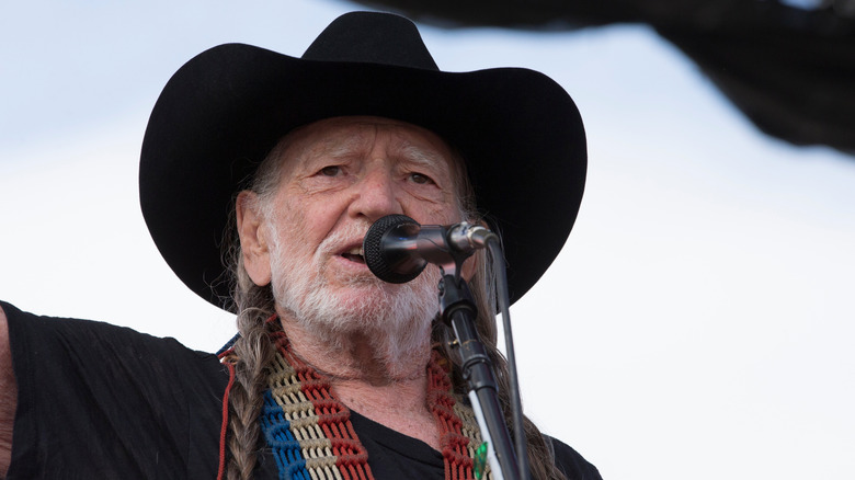 Willie Nelson performing at a festival
