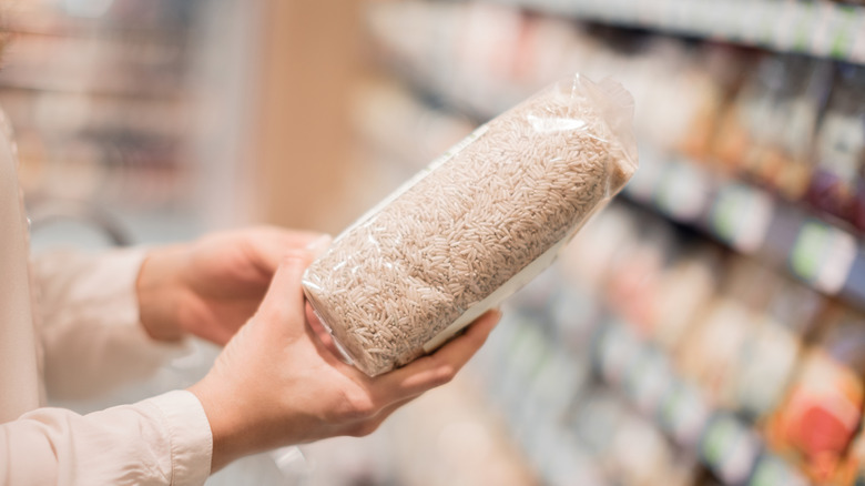 Woman selecting rice at store