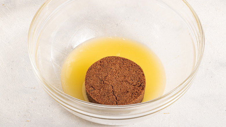 Bowl with melted butter and dark brown sugar