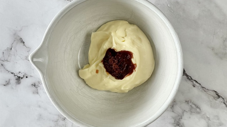 mayonnaise and chipotles in a measuring cup