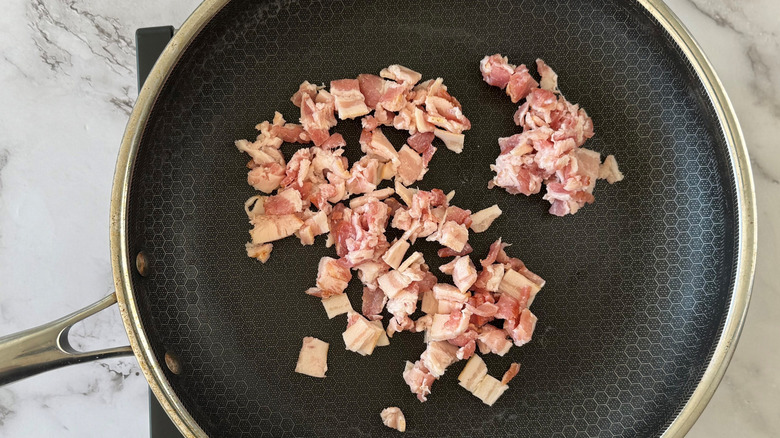 Chopped bacon in skillet