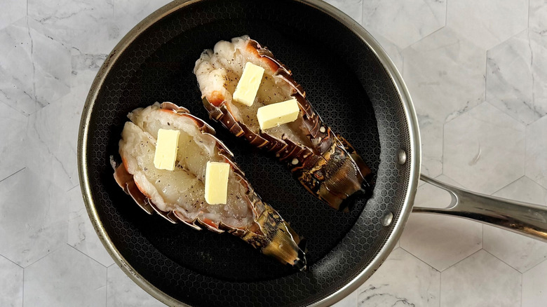 lobster tails in pan with water