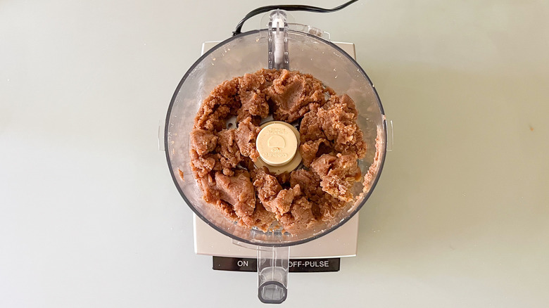 Processed dates and almond flour in food processor