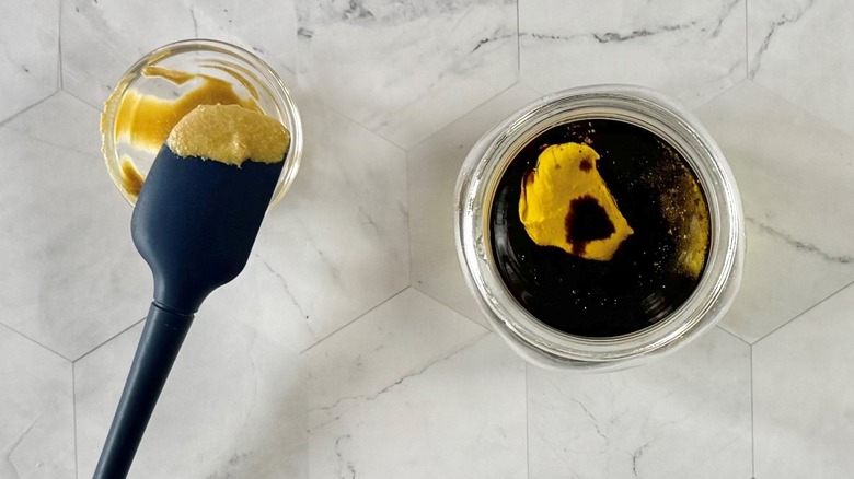 making mustard vinaigrette in glass jar