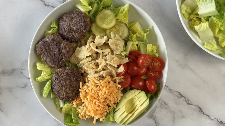 salad with burger patties