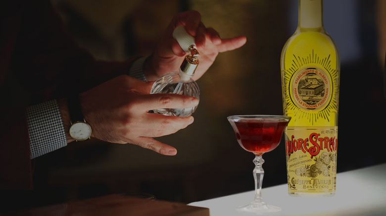 Spritzing a glass of strega