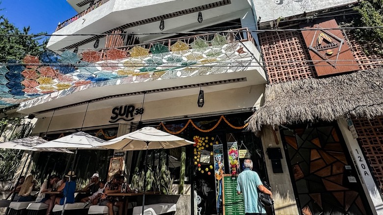 Sur38 storefront with patio tables