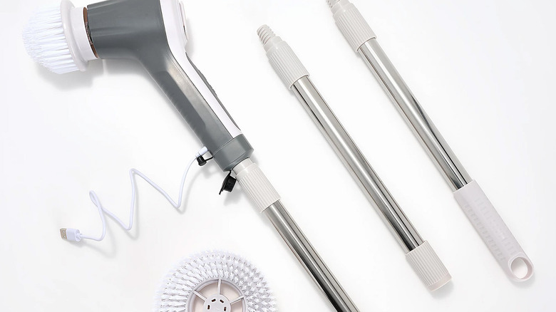 The Teko Power Scrubber and attachments rest against a white background