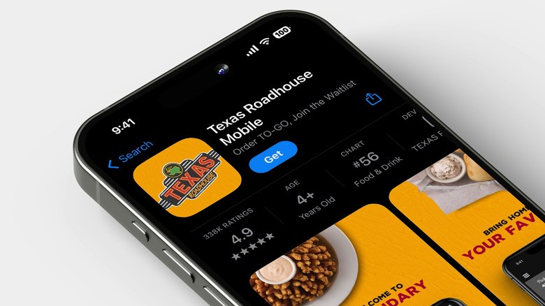 Smartphone opened to download option of Texas Roadhouse app