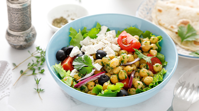 Mediterranean salad with chickpeas served in bowl