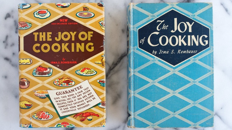 Two vintage editions of The Joy of Cooking on a marble surface