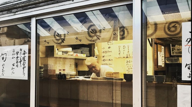 Looking through the window at the owner of Motodane