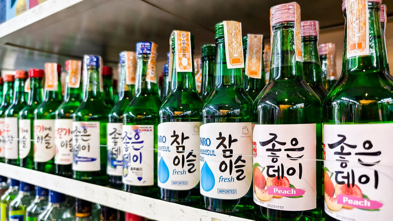 Bottles of flavored soju on store shelf