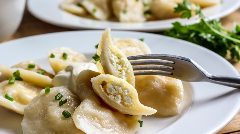 Bowl of pierogies with fork