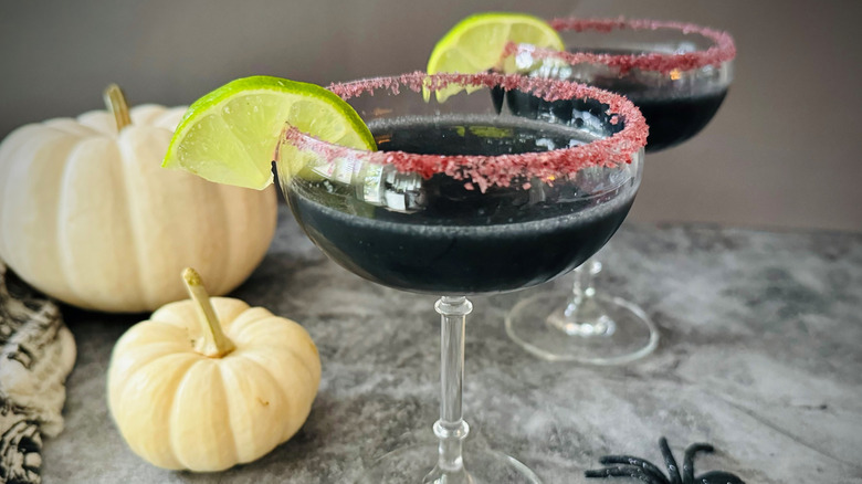 black cocktails with Halloween decor