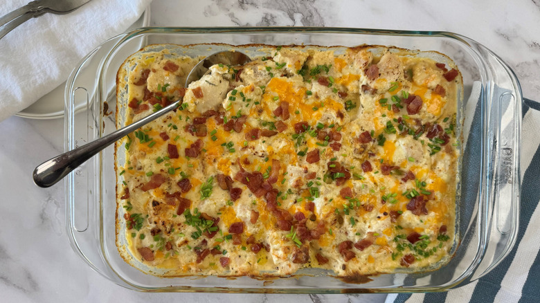 cheesy creamy chicken casserole with spoon