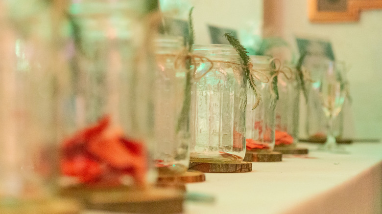 A line of decorated Mason jars