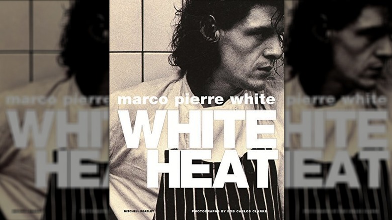 The front cover of White Heat, Marco looks to his left in a black and white grainy phot