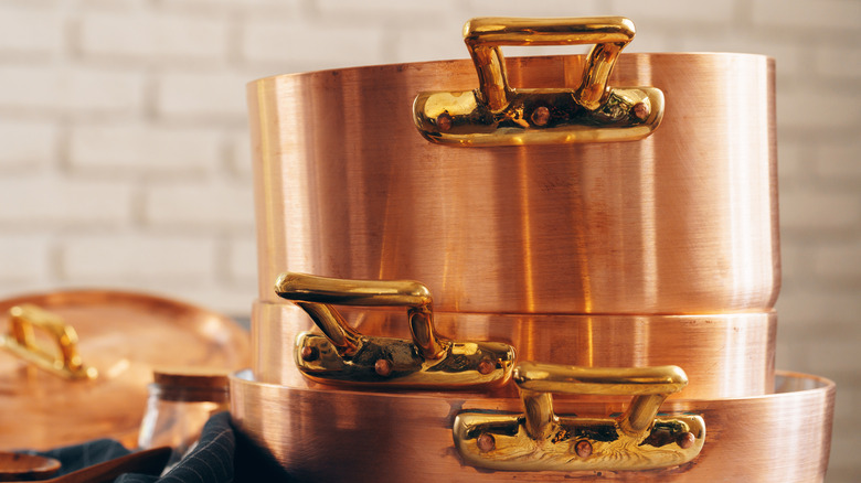Shiny copper cookware in a kitchen