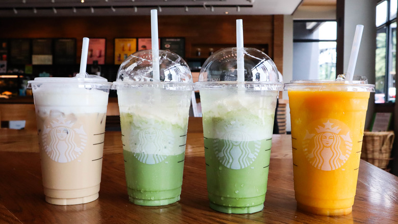 Starbucks iced smoothies in plastic ups with in various colors